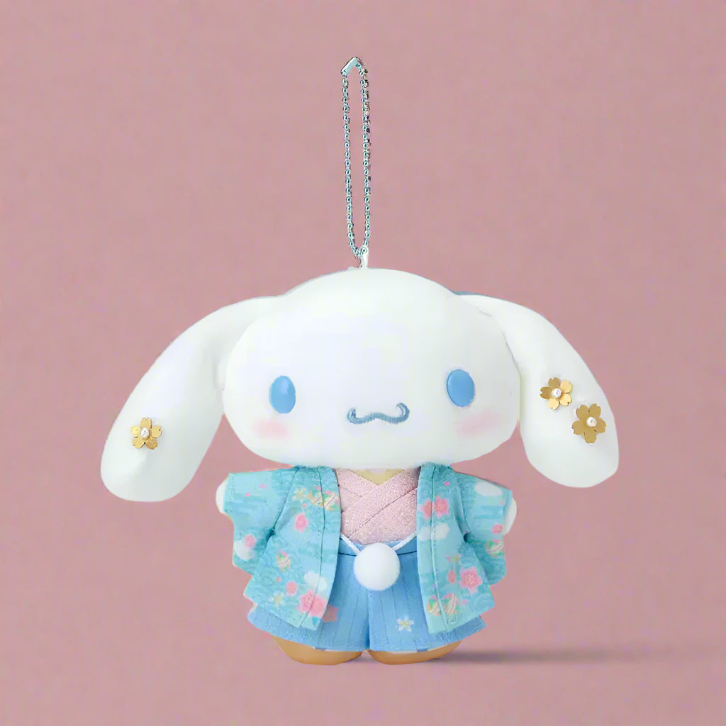 Plush keychain with a cute character wearing a blue outfit on a white background