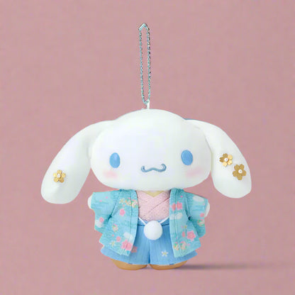 Plush keychain with a cute character wearing a blue outfit on a white background