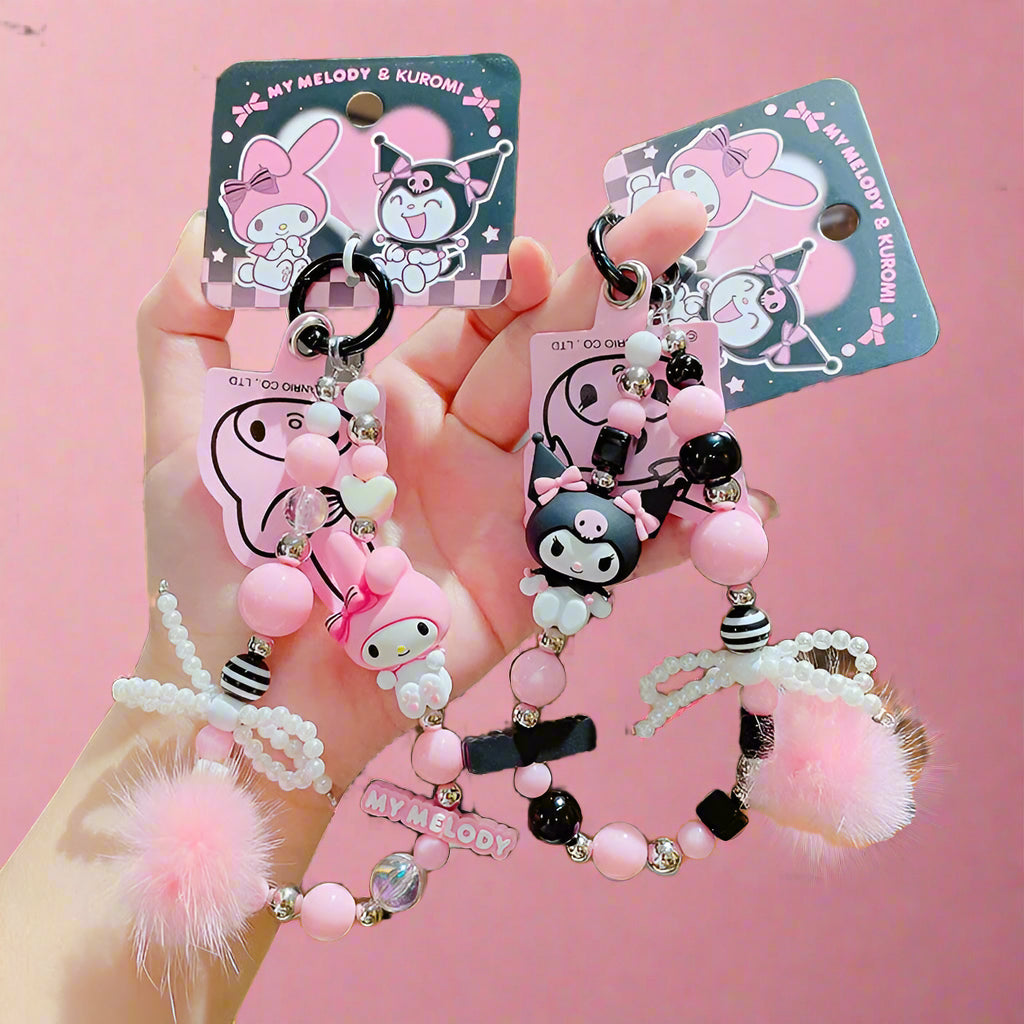 Two beaded mobile phone keychains featuring characters from Sanrio's Kuromi & My Melody series, with pink and white colors and decorative elements.