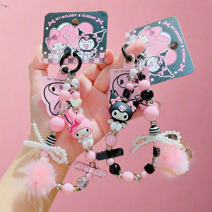 Two beaded mobile phone keychains featuring characters from Sanrio's Kuromi & My Melody series, with pink and white colors and decorative elements.