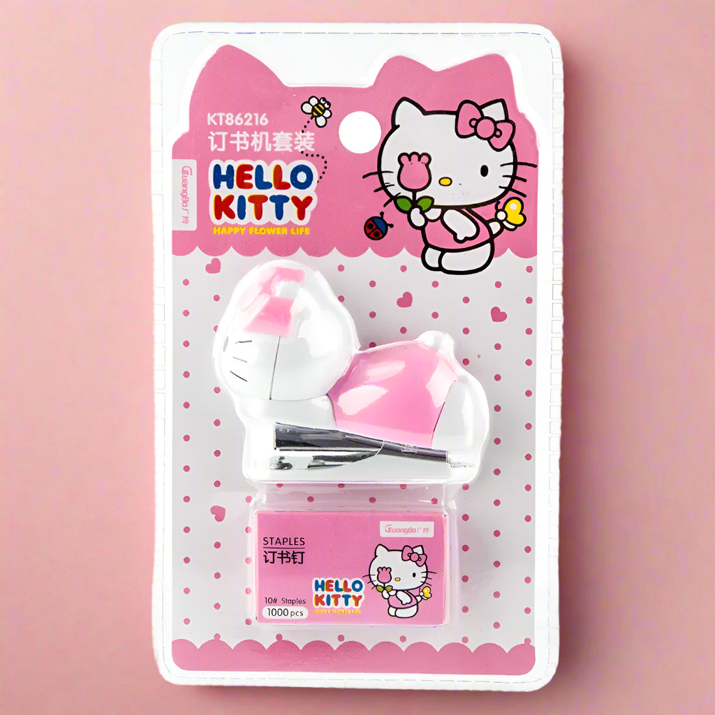 Packaged Hello Kitty themed stapler sets, featuring the character in pink and white colors on the packaging, with the brand name 'Sanrio' visible.