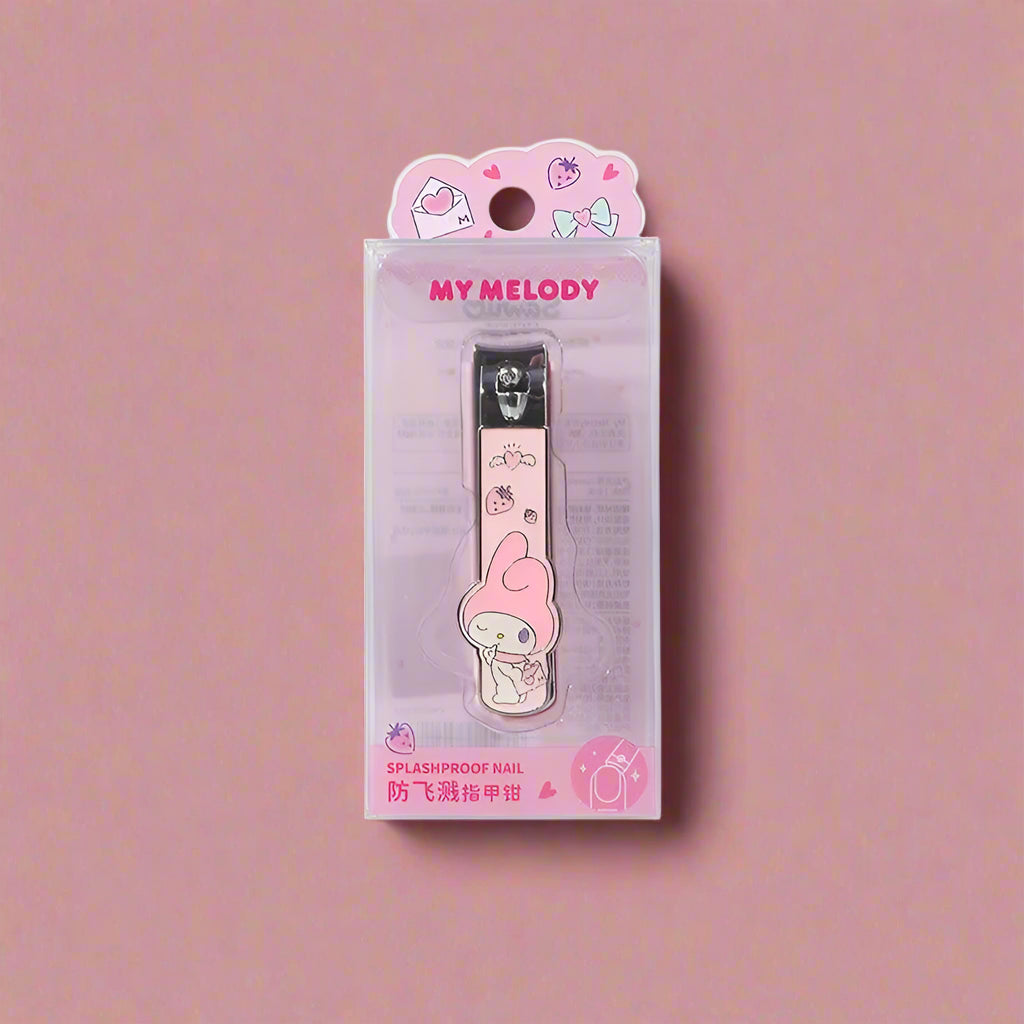 A collection of four nail-clippers with Sanrio characters designs, displayed against a pink and peach background.
