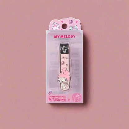 A collection of four nail-clippers with Sanrio characters designs, displayed against a pink and peach background.