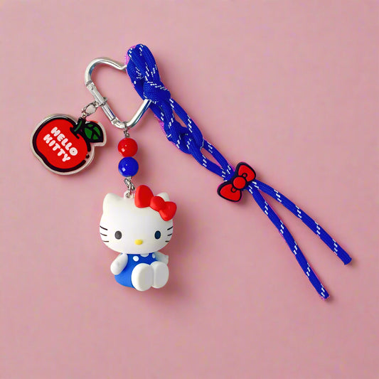 Hello Kitty keychain with blue strap on a white background