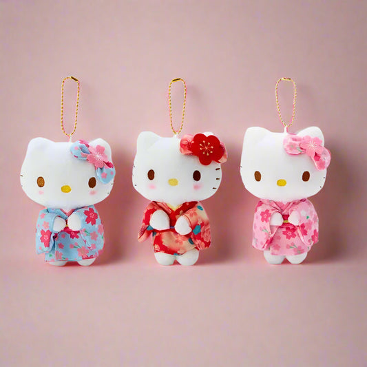 A set of three Hello Kitty plushie keychains wearing matcha green kimono outfits with floral accents.