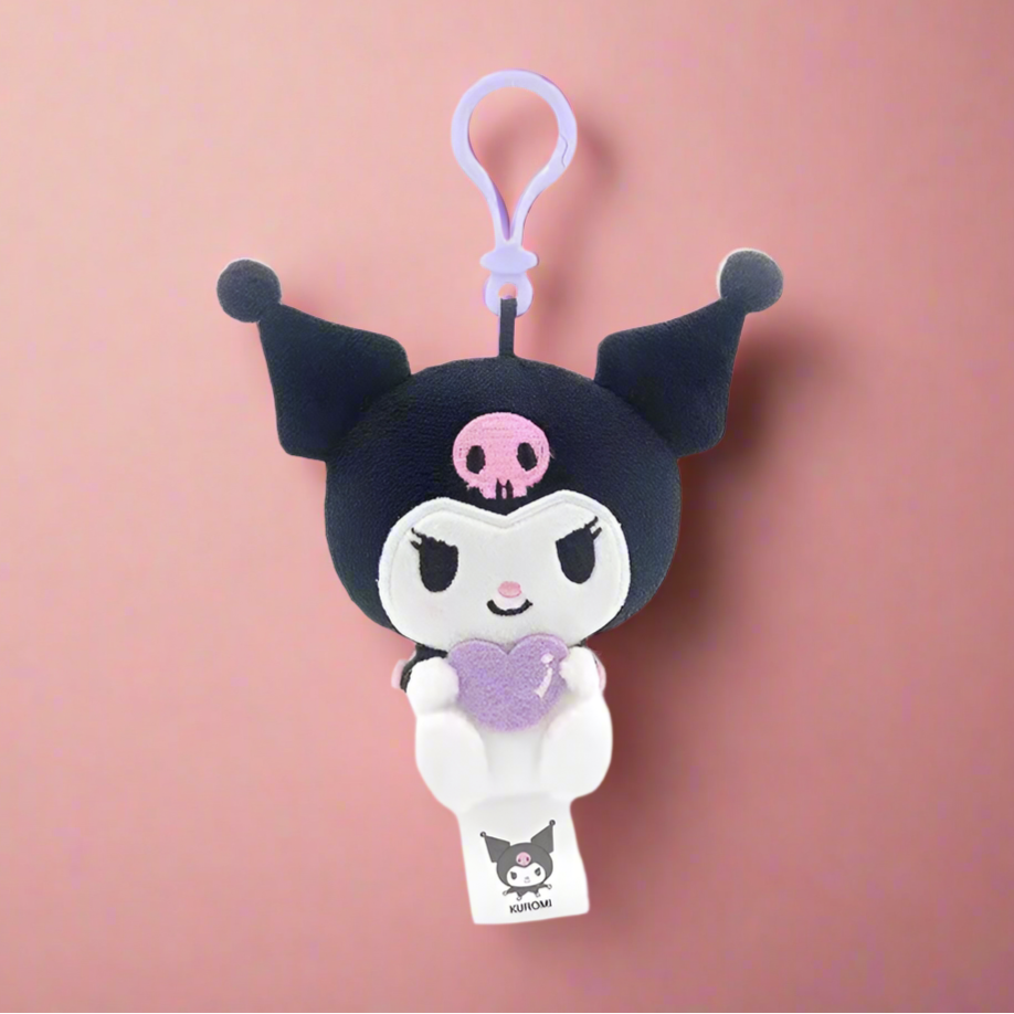 Two plush keychains featuring characters from Sanrio, one designed like a white cat with a blue heart and the other like a white bear with a red heart.