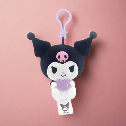 Two plush keychains featuring characters from Sanrio, one designed like a white cat with a blue heart and the other like a white bear with a red heart.