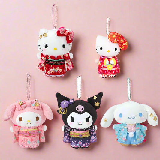 Five colorful plush toys in traditional Japanese kimono designs on a white background