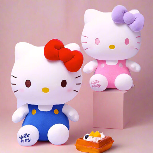 Two Hello Kitty plush toys with a small cake on a pink background