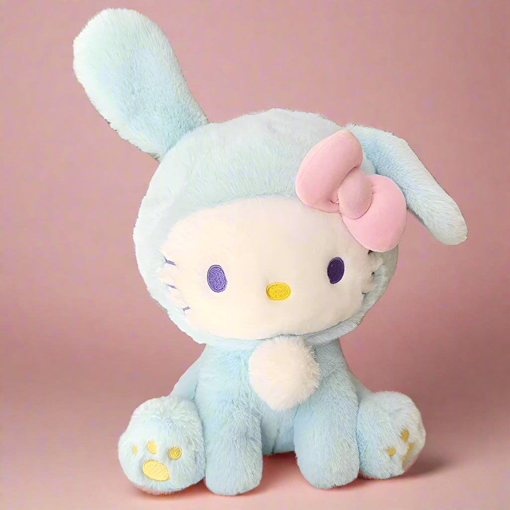 Two plushie toys, one in blue rabbit attire and the other in pink with a bow, resembling the Hello Kitty character.