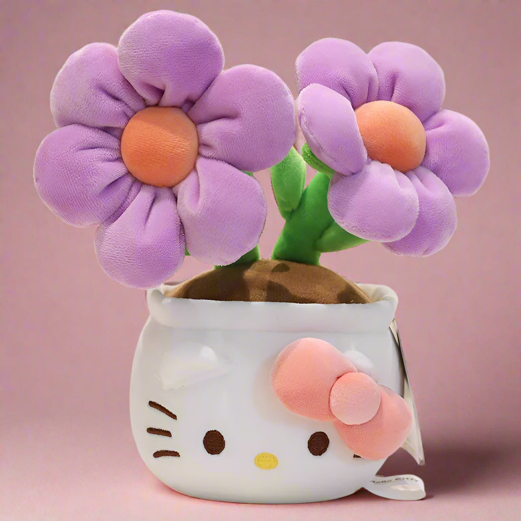 A plush flower bouquet with two flowers, one red and one pink, each with a Hello Kitty character design on the pot. The bouquet is displayed on a white grid surface.