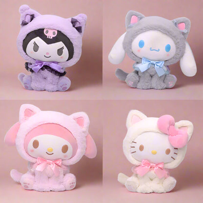 Four different plushies of Sanrio characters, each with distinct colors and designs. Top left is purple with a skull motif, top right is gray with a cat-like appearance, bottom left is pink resembling a rabbit, and bottom right is white and pink resembling a cat with a bow.