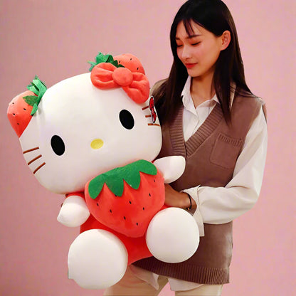 Person holding a large plush toy resembling a strawberry-themed character in a room with plants and furniture.