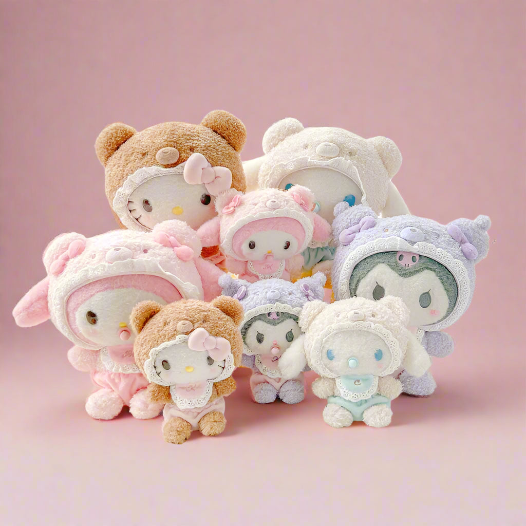 Collection of cute plush toys with animal hats on a white surface, branded 'Yoga Official'.