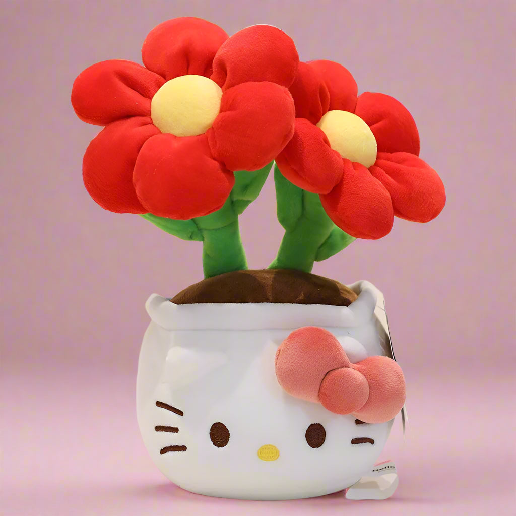 A plush flower bouquet with two flowers, one red and one pink, each with a Hello Kitty character design on the pot. The bouquet is displayed on a white grid surface.