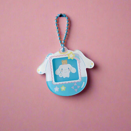 Cartoon character keychain on a light gray background with decorative stars.