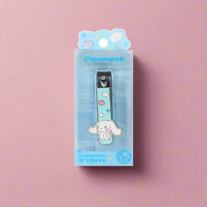A collection of four nail-clippers with Sanrio characters designs, displayed against a pink and peach background.