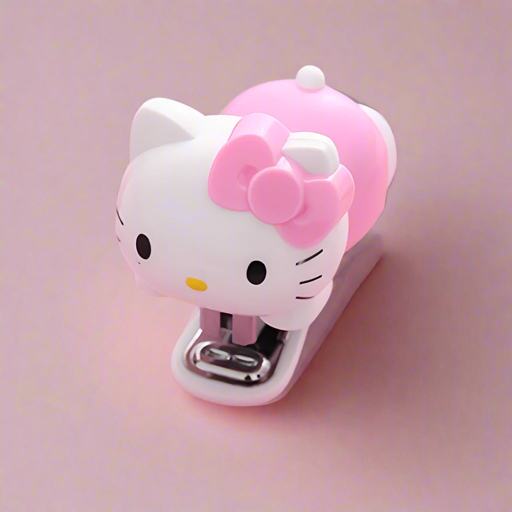 Hello Kitty-themed stapler on a pink background