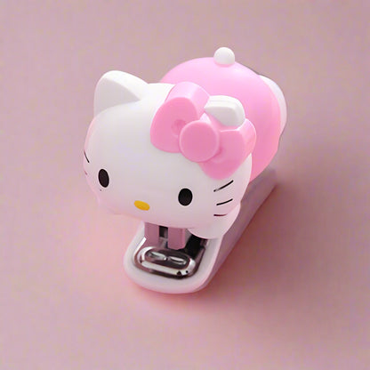 Hello Kitty-themed stapler on a pink background