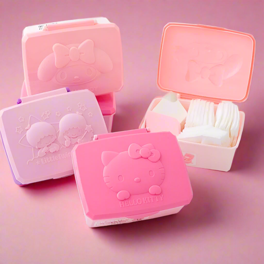 A collection of Sanrio portable storage boxes with pink and white colors, featuring character designs on the lids.