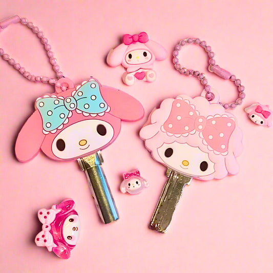 Cute cartoon character keychains with bows on a pink background